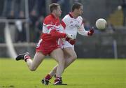 18 May 2003; Stephen O'Neill, Tyrone, in action against Derry's Anthony Tohill. Bank of Ireland Ulster Senior Football Championship, Tyrone v Derry, St. Tighearnach's Park, Clones, Co. Monaghan. Picture credit; Damien Eagers / SPORTSFILE *EDI*