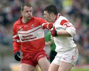 24 May 2003; Sean Cavangh, Tyrone, iis tackled by Derry's Anthony Tohill. Bank of Ireland Ulster Senior Football Championship replay, Tyrone v Derry, Casement Park, Belfast. Picture credit; Damien Eagers / SPORTSFILE *EDI*