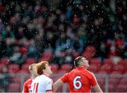 10 March 2013; Peter Harte, Tyrone, and Noel O'Leary, Cork, watch a Tyrone point go over the bar during a snow shower. Allianz Football League, Division 1, Tyrone v Cork, Healy Park, Omagh, Co. Tyrone. Picture credit: Brian Lawless / SPORTSFILE