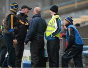 10 March 2013; Kilkenny manager Brian Cody, second from left, and John Hayes, far right, Tipperary backroom staff, after the Kilkenny player Tommy Walsh was sent off by referee Michael Wadding. Allianz Hurling League, Division 1A, Tipperary v Kilkenny, Semple Stadium, Thurles, Co. Tipperary. Picture credit: David Maher / SPORTSFILE