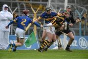 10 March 2013; Eoin Larkin, Kilkenny, in action against Tipperary players, left to right, Paddy Stapleton, Paul Curran and Darren Gleeson. Allianz Hurling League, Division 1A, Tipperary v Kilkenny, Semple Stadium, Thurles, Co. Tipperary. Picture credit: David Maher / SPORTSFILE