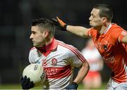 9 March 2013; Lee Kennedy, Derry, in action against James Morgan, Armagh. Allianz Football League, Division 2, Derry v Armagh, Celtic Park, Derry. Picture credit: Oliver McVeigh / SPORTSFILE