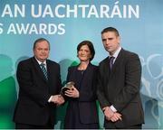 15 March 2013; Marie Uí Sé, wife of the late Páidí Ó Sé, of Ceann Trá, Co. Chiarraí, and her nephew Fergal Ó Sé, are presented with their GAA President's Award for 2013 by Uachtarán Chumann Lúthchleas Gael Liam Ó Néill. The Ó Sé Family have made an incalculable contribution to Gaelic football and by extension the GAA over a prolonged period that stretches across two generations and five decades. The late Páidí Ó Sé is considered to be one of the greatest footballers of all time, winning eight All-Ireland medals, numerous All-Stars and almost every honour the game has to offer. His nephews Fergal, Darragh, Tomás and Marc have represented between them both An Ghaeltacht and Kerry with distinction claiming county, provincial and national honours with the latter two still members of the Kerry senior football team. Páidí’s son Pádraig Óg is a current member of the Kerry U21 panel managed by Darragh. GAA President's Awards 2013, Croke Park, Dublin. Picture credit: Brian Lawless / SPORTSFILE