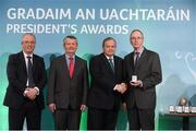 15 March 2013; Michael Dowling is presented with his GAA President's Awards for 2013 award by Uachtarán Chumann Lúthchleas Gael Liam Ó Néill in the company of Neil Hosty, AIB, left, and Pól Ó Gallchóir, Ceannaái TG4. For the last 30 years, Michael has developed and promoted the game of Rounders within his local GAA club, Heath. A pillar of the community and an inspiration behind the sustainment of Rounders, the success of the senior side can be attributed directly to his effort behind the scenes throughout that period. GAA President's Awards 2013, Croke Park, Dublin. Picture credit: Brian Lawless / SPORTSFILE