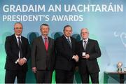 15 March 2013; Noel Murphy is presented with his GAA President's Awards for 2013 award by Uachtarán Chumann Lúthchleas Gael Liam Ó Néill in the company of Neil Hosty, AIB, left, and Pól Ó Gallchóir, Ceannaái TG4. A native of Drumcondra and one of the founding members of the Trinity Gaels GAA Club in Dublin. Noel represented Dublin in both minor hurling and junior football in the 50’s and 60’s respectively. He has served his club and Dublin County Board in a variety of roles and held the positions of Head Steward and Event Controller in Parnell Park. Noel was also a voluntary Croke Park steward for many years and held a number of key head steward positions. GAA President's Awards 2013, Croke Park, Dublin. Picture credit: Brian Lawless / SPORTSFILE