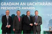 15 March 2013; Johnny O’Rourke is presented with his GAA President's Awards for 2013 award by Uachtarán Chumann Lúthchleas Gael Liam Ó Néill in the company of Neil Hosty, AIB, left, and Pól Ó Gallchóir, Ceannaái TG4. A stalwart of Ballyea club, Inagh-Kilnamona, Johnny has been a major driving force behind the development of the club and its facilities for over 40 years. Between coaching and development of players through every level and these days, the maintenance of the club’s pitch and clubrooms, Johnny is all that embodies Clare GAA. GAA President's Awards 2013, Croke Park, Dublin. Picture credit: Brian Lawless / SPORTSFILE