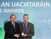 15 March 2013; Johnny O’Rourke is presented with his GAA President's Awards for 2013 award by Uachtarán Chumann Lúthchleas Gael Liam Ó Néill. A stalwart of Ballyea club, Inagh-Kilnamona, Johnny has been a major driving force behind the development of the club and its facilities for over 40 years. Between coaching and development of players through every level and these days, the maintenance of the club’s pitch and clubrooms, Johnny is all that embodies Clare GAA. GAA President's Awards 2013, Croke Park, Dublin. Picture credit: Brian Lawless / SPORTSFILE