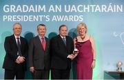 15 March 2013; Mary Gavin is presented with her GAA President's Awards for 2013 award by Uachtarán Chumann Lúthchleas Gael Liam Ó Néill in the company of Neil Hosty, AIB, left, and Pól Ó Gallchóir, Ceannaái TG4. Originally from Mt. Bellew/Moylough, Co. Galway, Mary Gavin travelled to the Netherlands in 1982 on a short Summer holiday and ended up making a life for herself there for the last 30 years. In that time, she has pioneered new ways in how to promote the GAA brand in new countries and in her club The Hague  and is one of the finest international ambassadors of our game abroad. GAA President's Awards 2013, Croke Park, Dublin. Picture credit: Brian Lawless / SPORTSFILE