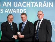 15 March 2013; Michael Mulhare is presented with his GAA President's Awards for 2013 award by Uachtarán Chumann Lúthchleas Gael Liam Ó Néill in the company of his brother Joe Mulhare, right. Mick has been one of the most influential members of Stradbally GAC since its foundation. After finishing up his playing career, he became club secretary in 1975 before stepping up to Chairman in 1988. Mick had an instrumental role in the changing of the clubs grounds from Cosby Hall in ’93 to Bill Delaney Park and this has been credited with being the main reason for the subsequent three county championship successes for Stradbally in 1997, 1998 and 2005. GAA President's Awards 2013, Croke Park, Dublin. Picture credit: Brian Lawless / SPORTSFILE