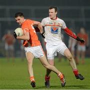 16 March 2013; Stephen Harold, Armagh, in action against Mark Brennan, Louth. Allianz Football League, Division 2, Armagh v Louth, Athletic Grounds, Armagh. Picture credit: Oliver McVeigh / SPORTSFILE