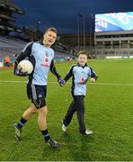 16 March 2013; Match day mascot Jack Donnelly, St Cronans, Swords, with Paul Flynn as they run out for the game. Allianz Football League, Division 1, Dublin v Tyrone, Croke Park, Dublin. Picture credit: Ray McManus / SPORTSFILE
