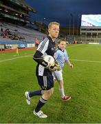 16 March 2013; Match day mascot Dylan Bryers, St Josephs, Fairview and goalkeeper Shane Supple as they run out for the game. Allianz Football League, Division 1, Dublin v Tyrone, Croke Park, Dublin. Picture credit: Ray McManus / SPORTSFILE