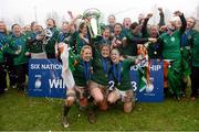 17 March 2013; Ireland captain Fiona Coghlan lifts the 6 Nations Trophy with Joy Neville, left, and Lynne Cantwell, right, as their team-mates celebrate. Women's 6 Nations Rugby Championship, Italy v Ireland, Parabiago, Milan, Italy. Picture credit: Matt Browne / SPORTSFILE