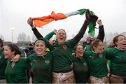 17 March 2013; Ireland's Joy Neville holds the Irish flag as her team-mates celebrate, including from left, Larissa Muldoon, Lynne Cantwell, Gillian Burke, Alison Miller and Niamh Kavanagh. Women's 6 Nations Rugby Championship, Italy v Ireland, Parabiago, Milan, Italy. Picture credit: Matt Browne / SPORTSFILE