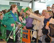 18 March 2013; Ireland captain Fiona Coghlan is greeted on the team's arrival home with the RBS Women's Six Nations Championship trophy. Terminal 2, Dublin Airport, Dublin. Picture credit: Brendan Moran / SPORTSFILE