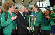 18 March 2013; Ireland captain Fiona Coghlan is greeted by IRFU President Billy Glynn on their arrival home with the RBS Women's Six Nations Championship trophy. Terminal 2, Dublin Airport, Dublin. Picture credit: Brendan Moran / SPORTSFILE