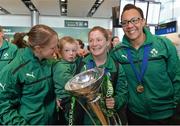 18 March 2013; Ireland's Grace Davitt, centre, with her nephew Cian O'Brien, age 4, and her team-mates Shannon Houston, left, and Shophie Spence and the RBS Women's Six Nations Championship trophy on their arrival home from the Women's 6 Nations Rugby Championship. Terminal 2, Dublin Airport, Dublin. Picture credit: Brendan Moran / SPORTSFILE