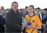 20 March 2013; Aimee Mackin, Glenamaddy Community School, is presented with the Player of the Match Award by Con Moynihan, LGFA Development Officer. Tesco HomeGrown Post Primary School Junior A Final, Glenamaddy Community School, Co. Galway v St Paul's High School, Co. Armagh, Glenamaddy GAA Club, Galway. Picture credit: Diarmuid Greene / SPORTSFILE