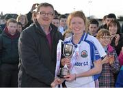 20 March 2013; Louise Ward, Glenamaddy Community School, is presented with the trophy by Con Moynihan, LGFA Development Officer. Tesco HomeGrown Post Primary School Junior A Final, Glenamaddy Community School, Co. Galway v St Paul's High School, Co. Armagh, Glenamaddy GAA Club, Galway. Picture credit: Diarmuid Greene / SPORTSFILE
