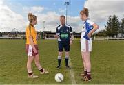 20 March 2013; Referee Paul Fahy performs the pre-match coin toss in the company of St Paul's High School captain Shauna Finnegan, left, and Glenamaddy Community School captain Louise Ward. Tesco HomeGrown Post Primary School Junior A Final, Glenamaddy Community School, Co. Galway v St Paul's High School, Co. Armagh, Glenamaddy GAA Club, Galway. Picture credit: Diarmuid Greene / SPORTSFILE