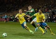 22 March 2013; James McClean, Republic of Ireland, in action against Sebastian Larsson, left, and Mikael Lustig, Sweden. 2014 FIFA World Cup Qualifier, Group C, Sweden v Republic of Ireland, Friends Arena, Solna, Stockholm, Sweden. Picture credit: David Maher / SPORTSFILE