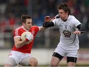 24 March 2013; Mark Donnelly, Tyrone, in action against Emmet Bolton, Kildare. Allianz Football League Division 1, Kildare v Tyrone, St Conleth's Park, Newbridge, Co. Kildare. Photo by Sportsfile