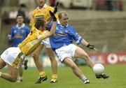 25 May 2003; Michael Graham, Cavan, in action against Antrim's Anto Finnegan. Bank of Ireland Ulster Senior Football Championship, Antrim v Cavan, Casement Park, Belfast. Picture credit; Damien Eagers / SPORTSFILE *EDI*