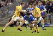 25 May 2003; Finbar O'Reilly of Cavan in action against Martin McCarry, right, and Mark McCrory of Antrim during the Ulster GAA Football Senior Championship Quarter-Final match between Antrim and Cavan at Casement Park in Belfast. Photo by Damien Eagers/Sportsfile