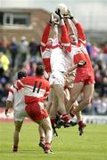 24 May 2003; Sean Cavangh, Tyrone, goes up for a high ball with Anthony Tohill and Fergal Doherty, Derry. Bank of Ireland Ulster Senior Football Championship replay, Tyrone v Derry, Casement Park, Belfast. Picture credit; Damien Eagers / SPORTSFILE *EDI*