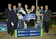 11 April 2003; Pictured at the presentation after Topofthebest had won the Boylesports Corn Cuchulainn Final are winning connections Ana Martin, Marketing Manager, Boylesports and Danny McNally, Trading Manager, Boylesports. Harold's Cross Greyhound Stadium, Harold's Cross, Dublin. Greyhond Racing. Picture credit; Ray McManus / SPORTSFILE *EDI*