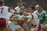 20 April 2003; Raymond Johnston, Fermanagh, is surrounded by Tyrone players Colin Holmes, 3, Philip Jordan, Brian Dooher and Michael McGee. Allianz National Football League, Division 1, Fermanagh v Tyrone, Croke Park, Dublin. Football. Picture credit; Ray McManus / SPORTSFILE *EDI*