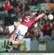 17 March 2003; Colin Corkery, Nemo Rangers, gets his shot away despite the attentions of Crossmolina's Tom Nallen. AIB All-Ireland Club Football Championship Final, Nemo Rangers v Crossmolina, Croke Park, Dublin. Picture credit; Ray McManus / SPORTSFILE