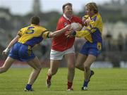 7 June 2003; Colin Corkery, Cork, in action against Roscommon's Morgan Beirne, 5, and David Casey. Bank of Ireland Senior Football Championship qualifier, Roscommon v Cork, Dr Hyde Park, Roscommon. Picture credit; Matt Browne / SPORTSFILE *EDI*