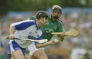 1 June 2003; Fergal Hartley, Waterford, in action against Limerick's Brian Begley. Guinness Munster Senior Hurling Championship, Limerick v Waterford, Semple Stadium, Thurles, Co. Tipperary. Picture credit; Brendan Moran / SPORTSFILE *EDI*
