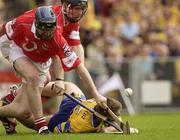 8 June 2003; James O'Connor, Clare, is tackled by Cork defenders Wayne Sherlock and Pat Mulcahy. Guinness Munster Senior Hurling  Championship Semi-final, Clare v Cork, Semple Stadium, Thurles, Co Tipperary. Picture credit; Ray McManus / SPORTSFILE  *EDI*