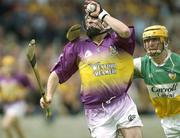 8 June 2003; Wexford's Paul Codd in action against Offaly's Ger Oakley. Guinness Leinster Senior Hurling Championship, Offaly v Wexford, Nowlan Park, Kilkenny. Picture credit; Damien Eagers / SPORTSFILE *EDI*