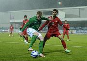 25 March 2013; Aiden O'Brien, Republic of Ireland, in action against Luís Martins, Portugal. U21 International Friendly, Republic of Ireland v Portugal, Oriel Park, Dundalk, Co. Louth. Photo by Sportsfile