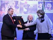 22 March 2013; John Keenan, Chairman of the Derry County Board, makes a presentation to Sabina Higgins, alongside the President of Ireland Michael D. Higgins, at the GAA Annual Congress 2013. The Venue, Limavady Road, Derry. Picture credit: Ray McManus / SPORTSFILE
