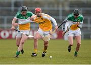 31 March 2013; Simon McCrory, Antrim, in action against Thomas Carroll, left, and Rory Hanniffy, Offaly. Allianz Hurling League, Division 1B, Antrim v Offaly, Casement Park, Belfast, Co. Antrim. Photo by Sportsfile