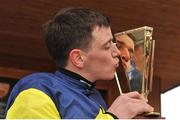 31 March 2013; Jockey Davy Condon holds up the Gold Cup after winning the the Powers Gold Cup on Realt Mor. Fairyhouse Racecourse, Co. Meath. Picture credit: Barry Cregg / SPORTSFILE
