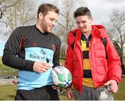 2 April 2013; Ulster's Darren Cave signs a ball for a supporter after squad training ahead of their Heineken Cup quarter-final against Saracens on Saturday. Ulster Rugby Squad Training, Lough Erne Hotel & Resort, Enniskillen, Co. Fermanagh. Picture credit: John Dickson / SPORTSFILE