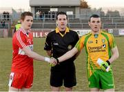3 April 2013; Derry captain Aaron Devlin, left, and Donegal captain Kevin McFadden shake hands in front of Referee Martin McNally. Cadbury Ulster GAA Football Under 21 Championship, Semi-Final, Donegal v Derry, Healy Park, Omagh, Co. Tyrone. Picture credit: Oliver McVeigh / SPORTSFILE