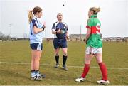 7 April 2013; Referee Des McEnry tosses a coin between  Dublin captain Sinead Finnegan and Mayo captain Fiona McHale before the game. TESCO HomeGrown Ladies National Football League, Division 2, Round 7, Dublin v Mayo, Naomh Mearnóg, Portmarnock, Co. Dublin. Picture credit: Barry Cregg / SPORTSFILE