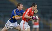 10 April 2013; John O'Rourke, Cork, in action against Conor O'Sullivan, Tipperary. Cadbury Munster GAA Football Under 21 Championship Final, Tipperary v Cork, Semple Stadium, Thurles, Co. Tipperary. Picture credit: Diarmuid Greene / SPORTSFILE