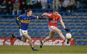 10 April 2013; Brian Hurley, Cork, in action against Darragh Kearney, Tipperary. Cadbury Munster GAA Football Under 21 Championship Final, Tipperary v Cork, Semple Stadium, Thurles, Co. Tipperary. Picture credit: Diarmuid Greene / SPORTSFILE