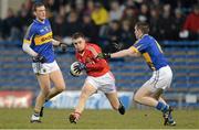10 April 2013; TJ Brosnan, Cork, in action against Seamus Kennedy and Ian Fahey, left, Tipperary. Cadbury Munster GAA Football Under 21 Championship Final, Tipperary v Cork, Semple Stadium, Thurles, Co. Tipperary. Picture credit: Diarmuid Greene / SPORTSFILE