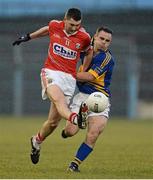 10 April 2013; Mark Surgue, Cork, in action against Paddy Dalton, Tipperary. Cadbury Munster GAA Football Under 21 Championship Final, Tipperary v Cork, Semple Stadium, Thurles, Co. Tipperary. Picture credit: Diarmuid Greene / SPORTSFILE