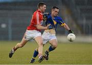 10 April 2013;  Paddy Dalton, Tipperary, in action against Mark Surgue, Cork. Cadbury Munster GAA Football Under 21 Championship Final, Tipperary v Cork, Semple Stadium, Thurles, Co. Tipperary. Picture credit: Diarmuid Greene / SPORTSFILE