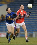 10 April 2013; Mark Surgue, Cork, in action against Dylan Fitzell, Tipperary. Cadbury Munster GAA Football Under 21 Championship Final, Tipperary v Cork, Semple Stadium, Thurles, Co. Tipperary. Picture credit: Diarmuid Greene / SPORTSFILE
