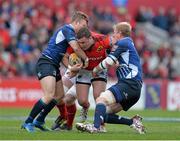 13 April 2013; Dave Kilcoyne, Munster, is tackled by Ian Madigan, left, and Leo Cullen, Leinster. Celtic League 2012/13, Round 20, Munster v Leinster, Thomond Park, Limerick. Picture credit: Diarmuid Greene / SPORTSFILE